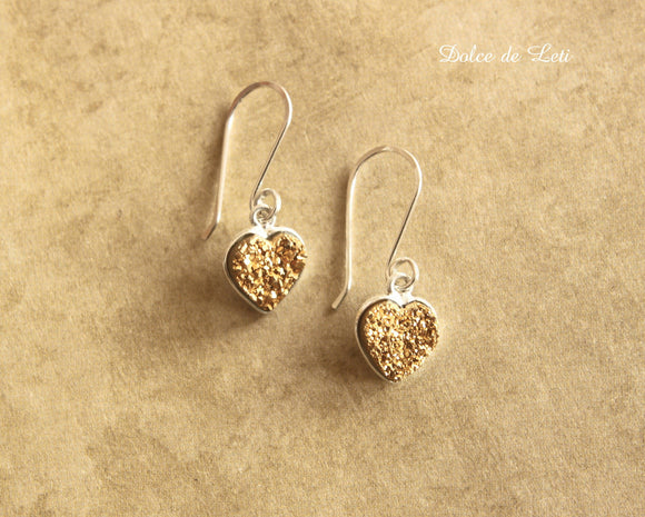 Gold druzy heart earrings.