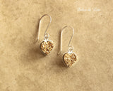 Gold druzy heart earrings.