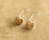 Gold druzy heart earrings.