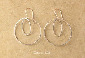 Round and oval sterling silver hoops earrings.