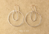 Round and oval sterling silver hoops earrings.